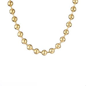 Detailed macro view of 18K gold plated hollow ball chain necklace in stainless steel