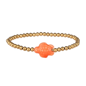 Detail of waterproof beaded bracelet with gold beads and an orange ceramic sea turtle