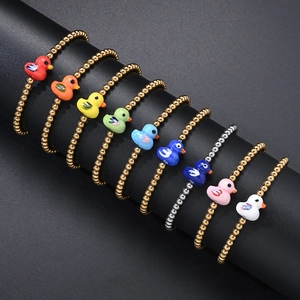 Set of nine colorful duck charm bracelets with gold and silver beads on a display