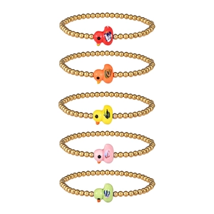 Detail view of five golden beaded bracelets featuring colorful enamel duck charms