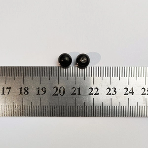 Detail of 10mm black round beads with drill holes for waterproof DIY bangle making