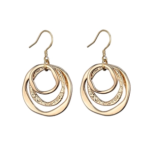 Macro detail of gold-plated triple layered irregular circle earrings with hammered texture
