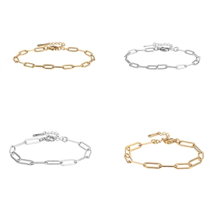 Detail of gold and silver stainless steel paperclip chain bracelets with lobster clasp closure