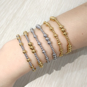 Stack of 18K gold and silver plated stainless steel beaded elastic bracelets for women
