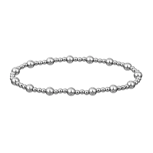 Macro detail of high-polish stainless steel bead bracelet with alternating size spheres
