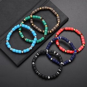 Colorful matte polymer clay cylinder beaded elastic bracelets with gold accents