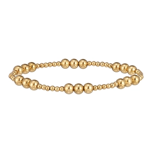 Detail of 18K gold plated stainless steel bracelet with alternating polished beads