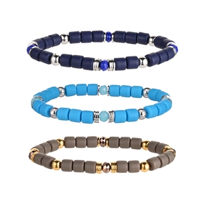 Three-piece set of cylindrical matte clay bead stretch bracelets in blue and taupe colors