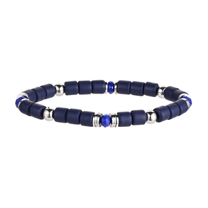 Detailed view of cylindrical navy beads and silver spacers on a matte stretch bracelet