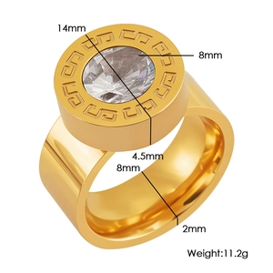 Detailed macro view showing the 11.2g gold-plated ring with meander pattern and clear zircon