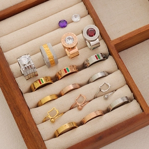 Detailed close-up of luxury stainless steel rings with zircon inlay and striped patterns