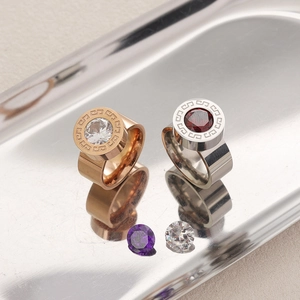 Fashionable thick metal rings with large zircon stones and Greek key patterns