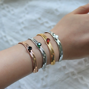 Flat snake bone chain bracelets in gold and silver with single zircon stone for women