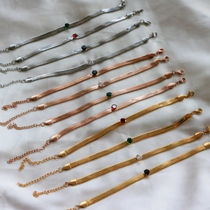 Flat herringbone bracelets in gold, silver and rose gold with colorful crystal accents