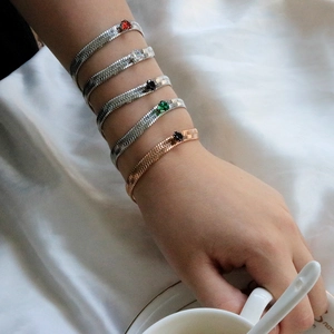 Flat snake chain bracelet set with heart-shaped colorful zircons in gold and silver finish