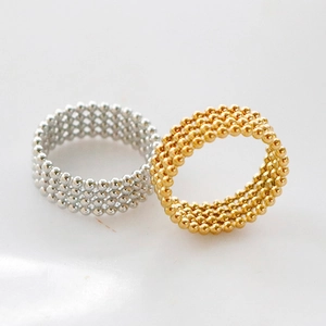 Minimalist beaded stackable rings in gold and silver finish with multi-layer design