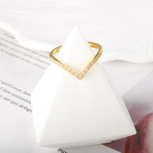 Elegant gold V-shaped heart ring featuring a minimalist design with sparkling cubic zirconia