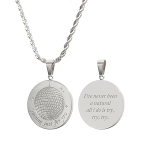 Detail of silver disco ball pendant with shining just for you text on a rope chain
