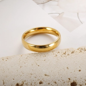 Classic 4mm 18K gold plated minimalist polished ring displayed on natural stone