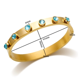 Luxe gouden roestvrijstalen armband met ingelegde 6 mm ronde lichtblauwe zirkoon