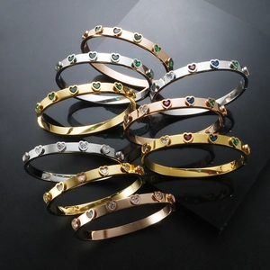 Top view of luxury heart crystal bracelets in gold, rose gold and silver finishes