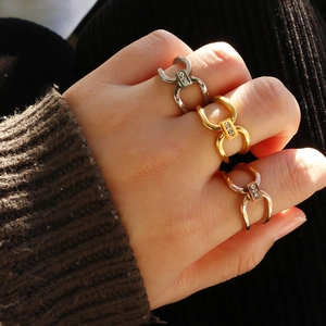 Geometric titanium steel ring with triple crystal inlay in gold, silver, and rose gold