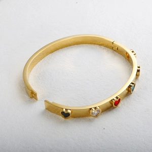 Polished gold-plated bangle featuring multi-colored heart-shaped zircon stones