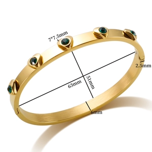18K gold plated stainless steel oval bangle with five green heart-shaped gemstones