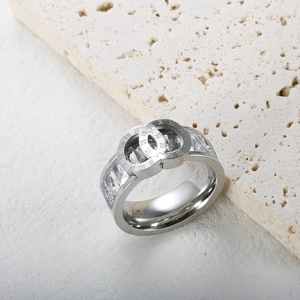 Detailed shot of silver Roman numeral crossover ring set with clear cubic zirconia stones