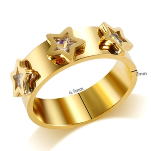 Gold wide band ring with three hollow star cutouts and clear cubic zirconia inlays