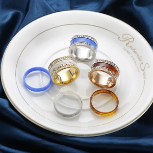 Three-piece stainless steel spinner ring set with resin inlay and cubic zirconia crystals