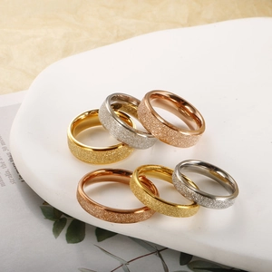 Minimalist matte titanium steel rings set in gold, silver, and rose gold finishes
