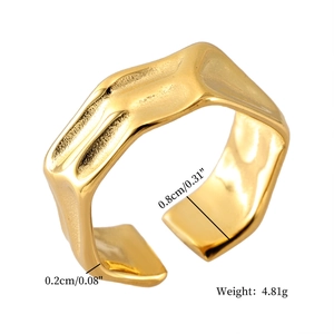 Detailed view of golden irregular textured ring showing 0.8cm width and 0.2cm thickness