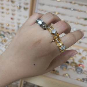 Fashionable stainless steel layered ring set with zircon accents in gold and gunmetal