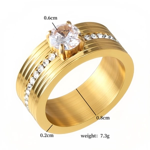 Detailed view of gold stainless steel ring with 0.8cm width and sparkling zircon stones