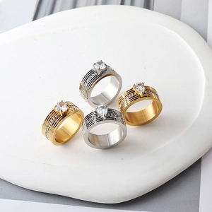 Polished stainless steel wide band rings with horizontal stripes and crystal center stones