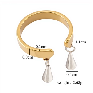 Detailed view of two-tone gold and silver earrings with polished teardrop pendants