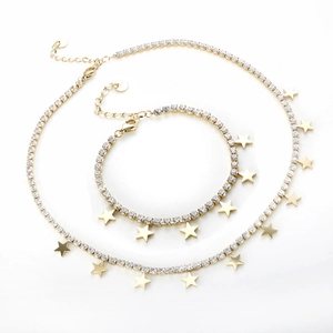 Set collana e bracciale tennis dorati con zirconi cubici e pendenti a stella
