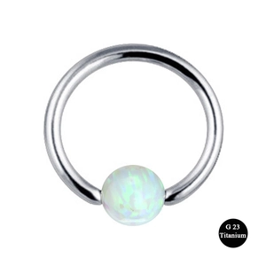 G23 titanium nose hoop ring featuring a green-purple opal ball on a white background
