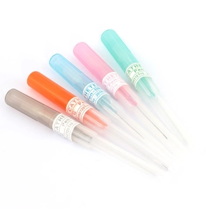 Detail view of multi-color pen-like IV catheters with medical labels and protective caps