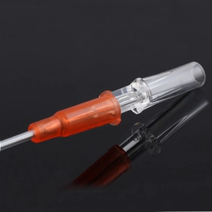 Macro shot of 20G orange IV catheter component with stainless steel needle and cannula