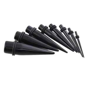 Set of 9 black acrylic ear tapers with O-rings in graduated sizes for ear stretching