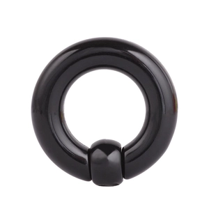 Detailed view of a sleek black captive bead ring for body piercing on white background