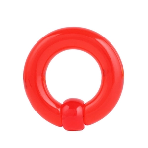 Macro shot of bright red acrylic captive bead ring body piercing jewelry for ear or nose