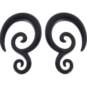 Detail of black acrylic spiral ear tapers showing polished smooth surface and scroll design