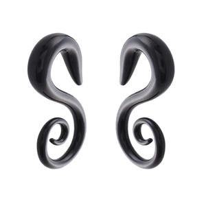 Close-up of black acrylic spiral snail ear gauges with a polished finish and sleek curved design