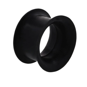 Close-up of black double flared silicone ear tunnel plug with matte finish texture