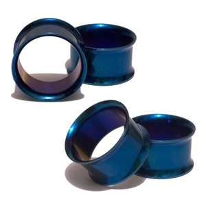 Close-up of royal blue double flare stainless steel ear tunnels with metallic finish