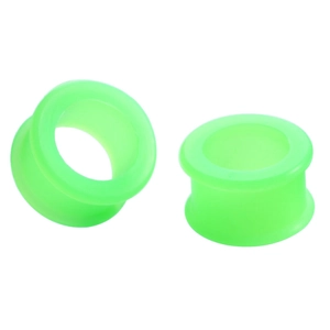 Detailed view of hollow neon green silicone ear gauges with flexible double-flared design