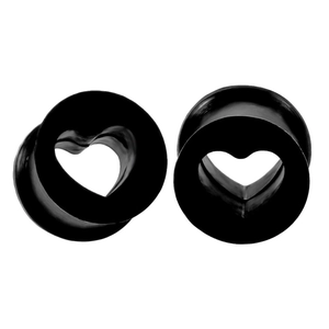 Detail of black heart-shaped silicone ear tunnels with hollow center and double flared design